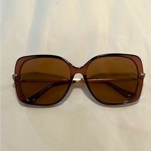 Sunglasses with brown tinted lenses